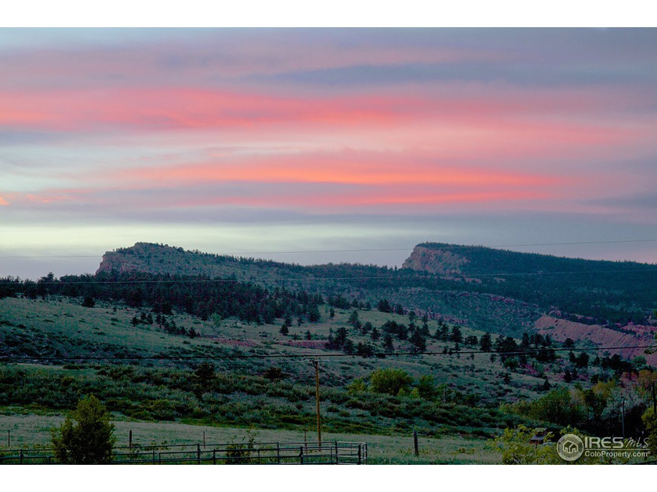 427 Red Gulch Road Lyons, CO 80540 - Photo 25 of 25 a view of a city with sunset