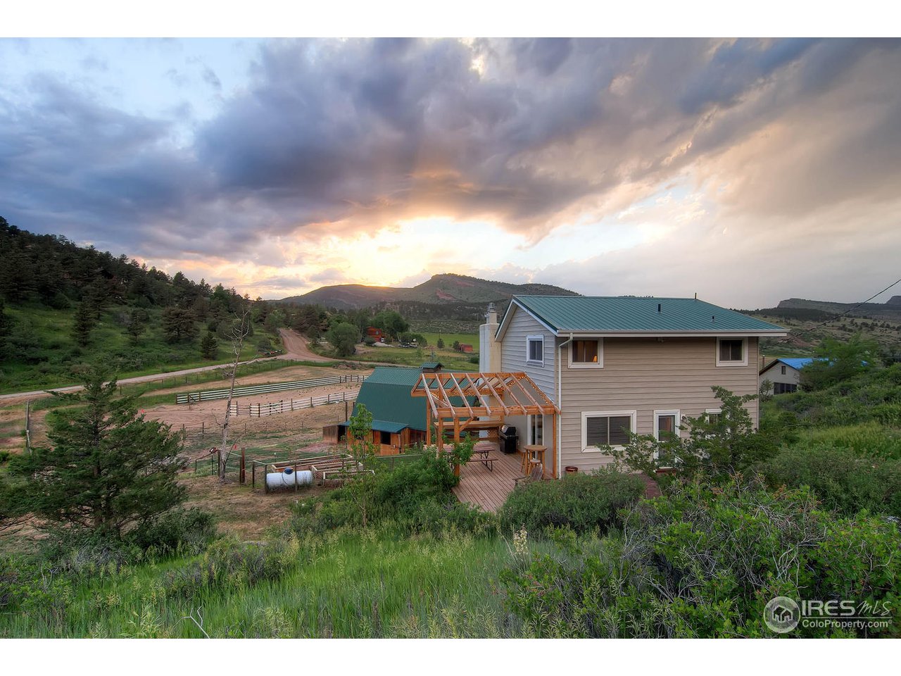 427 Red Gulch Road Lyons, CO 80540 - Photo 3 of 25 a view of a house with a yard and sitting area