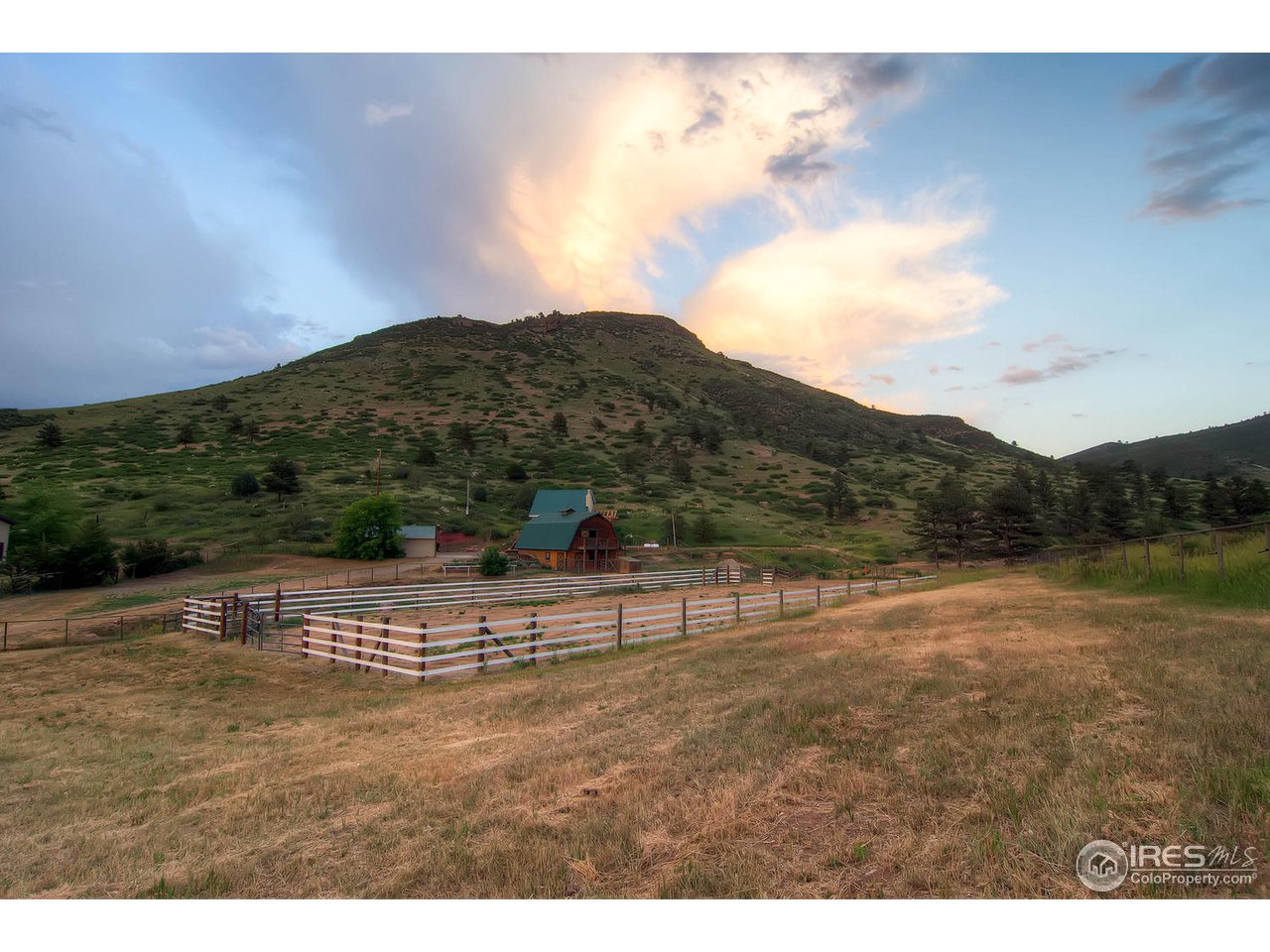 427 Red Gulch Road Lyons, CO 80540 - Photo 4 of 25 a view of a house with a yard