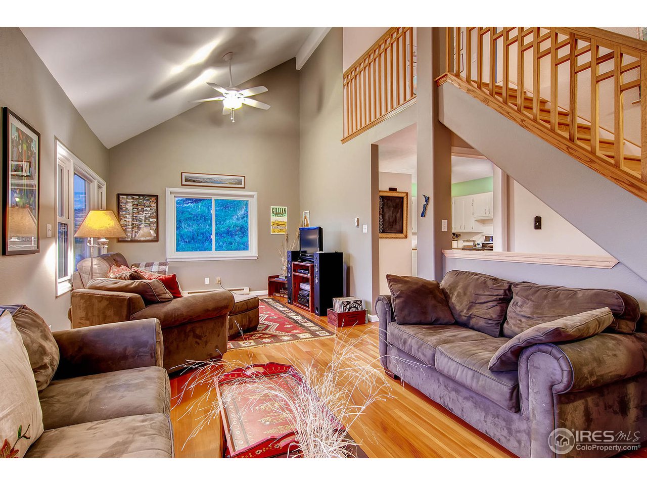 427 Red Gulch Road Lyons, CO 80540 - Photo 8 of 25 a living room with furniture a couch and dresser with wooden floor