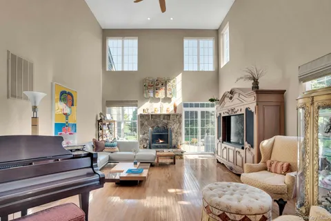 a living room with fireplace furniture and a fireplace