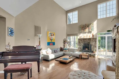 a living room with furniture fireplace and a table