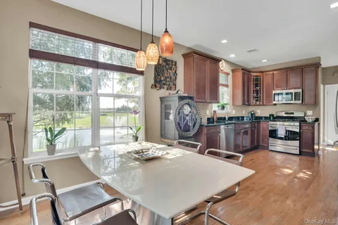 a view of a dining room with furniture window and outside view
