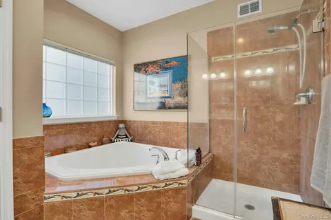 a bedroom with a bed and a lamp