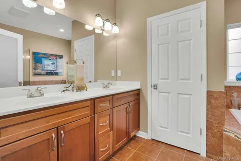 a bathroom with a bathtub and shower