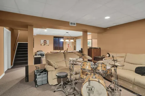 a room with pool table and a large window