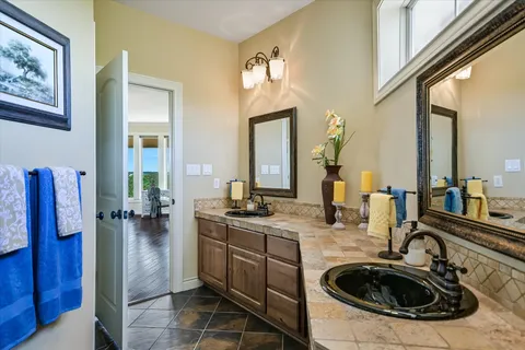 a bathroom with a sink double vanity and a mirror