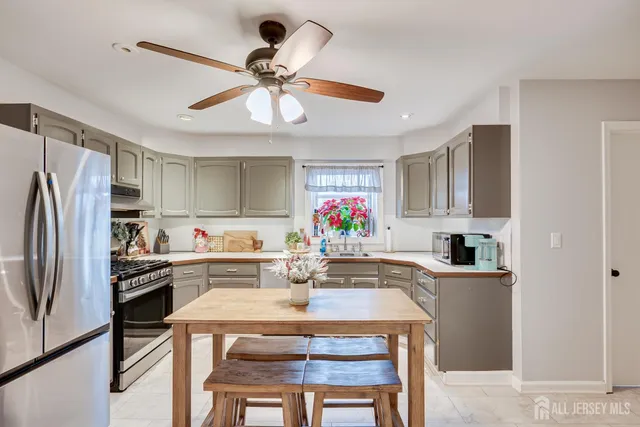 a kitchen with a dining table and chairs