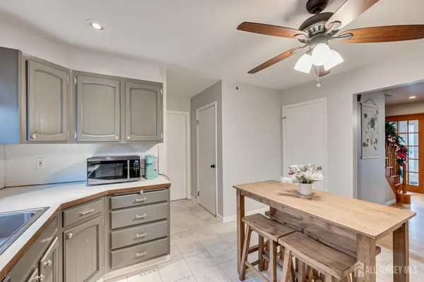 a kitchen with a sink cabinets and window