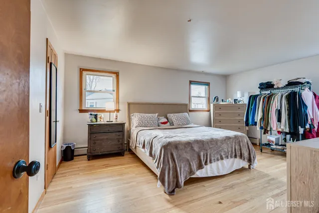 a bedroom with a bed and a walk in closet