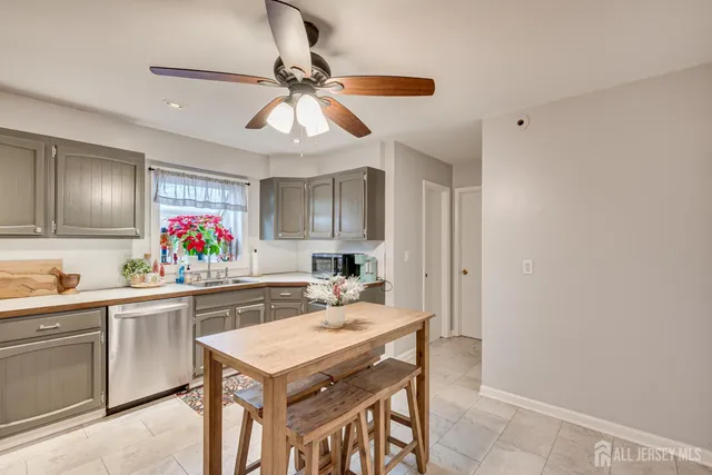 a kitchen with a table and chairs in it
