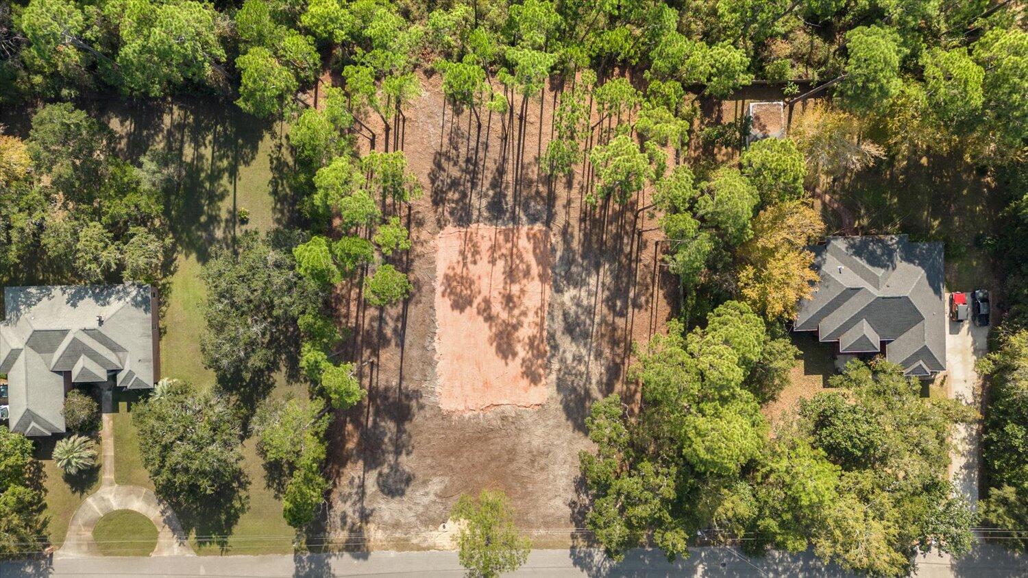 6455 Hammock Trace Milton, FL 32583 - Photo 20 of 20 a backyard of a building with trees all around