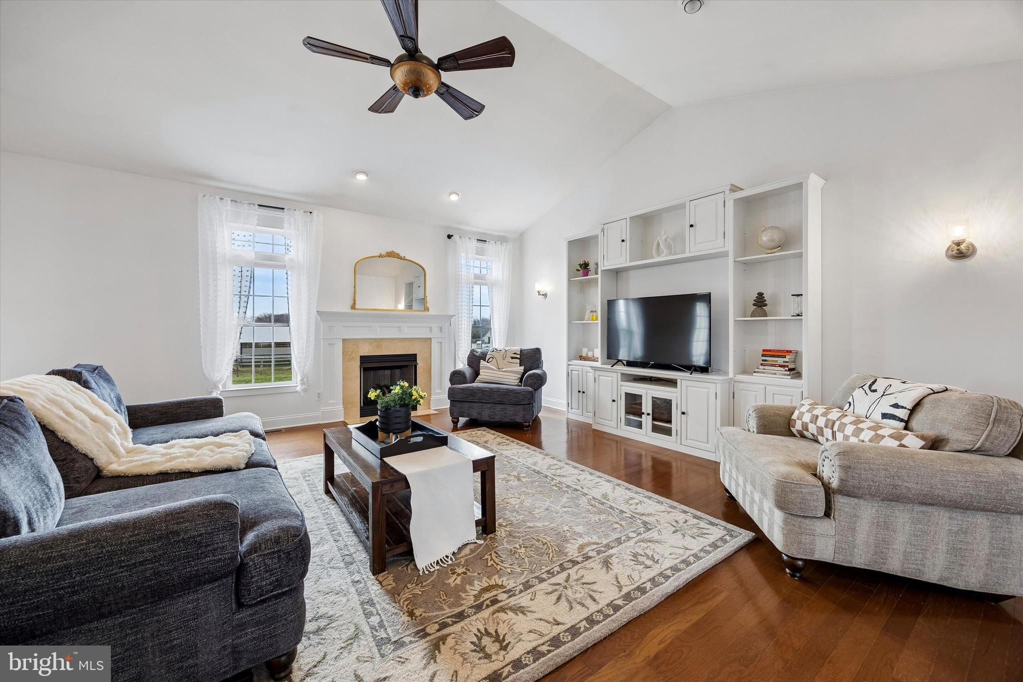 706 Kings Highway Mannington, NJ 08079 - Photo 13 of 35 a living room with furniture a fireplace and a flat screen tv