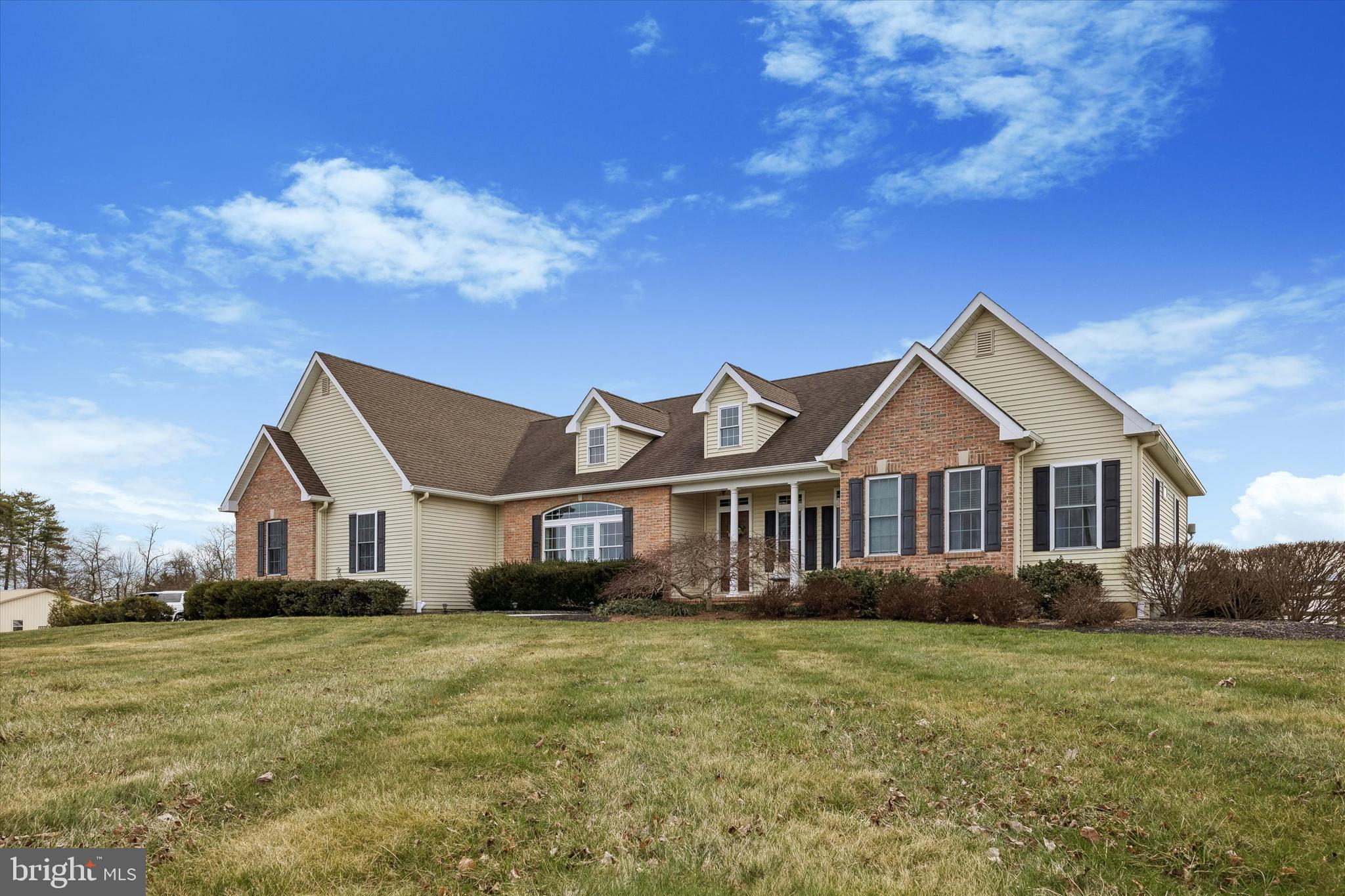 706 Kings Highway Mannington, NJ 08079 - Photo 2 of 35 a front view of a house with a garden and yard