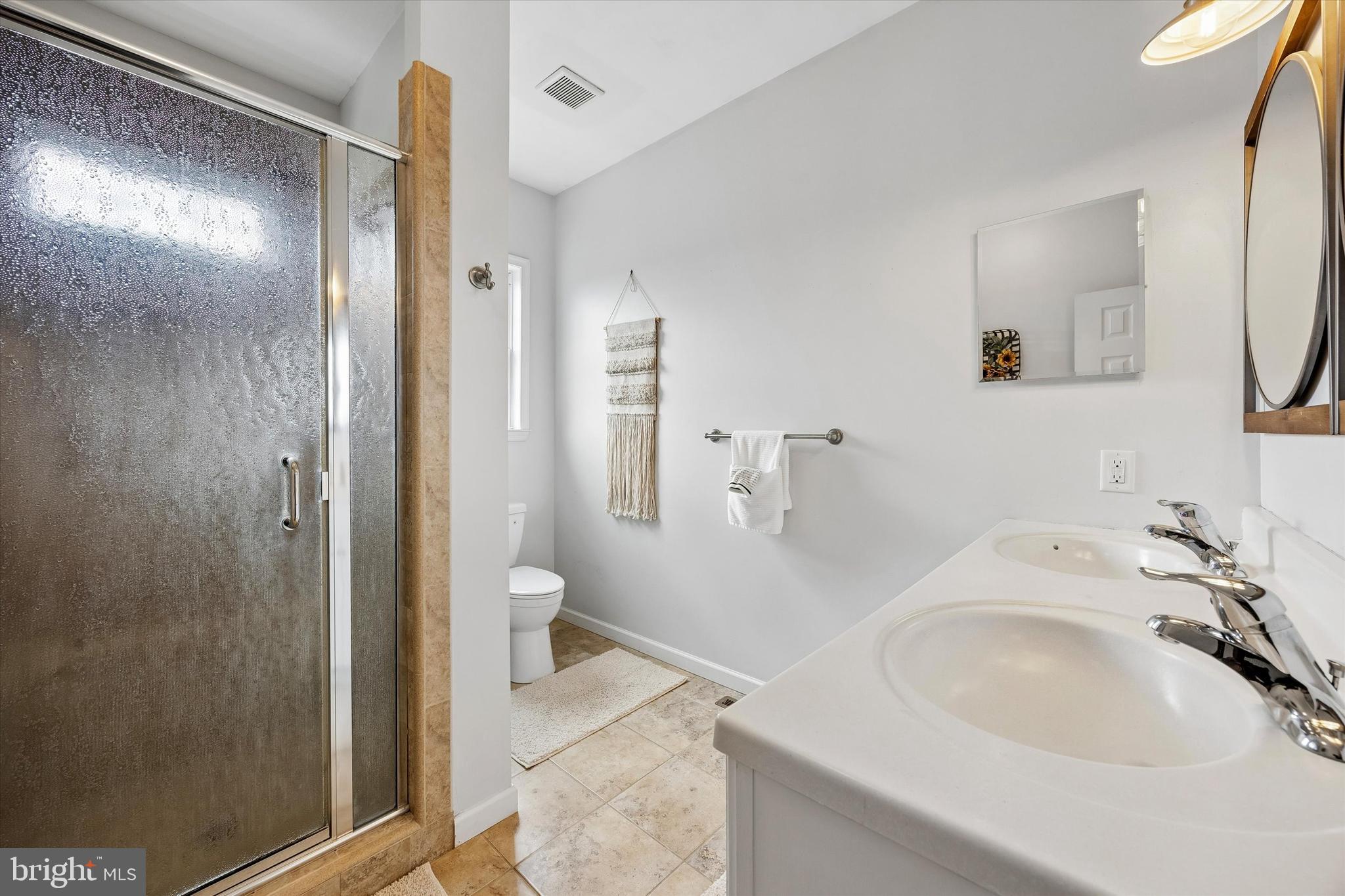 706 Kings Highway Mannington, NJ 08079 - Photo 23 of 35 a bathroom with a sink and a mirror