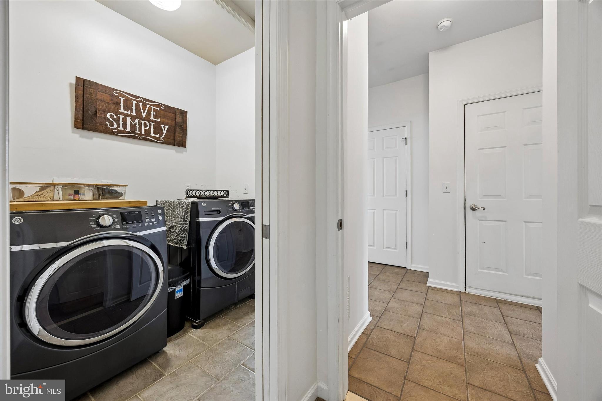 706 Kings Highway Mannington, NJ 08079 - Photo 24 of 35 a view of a hallway with washer and dryer