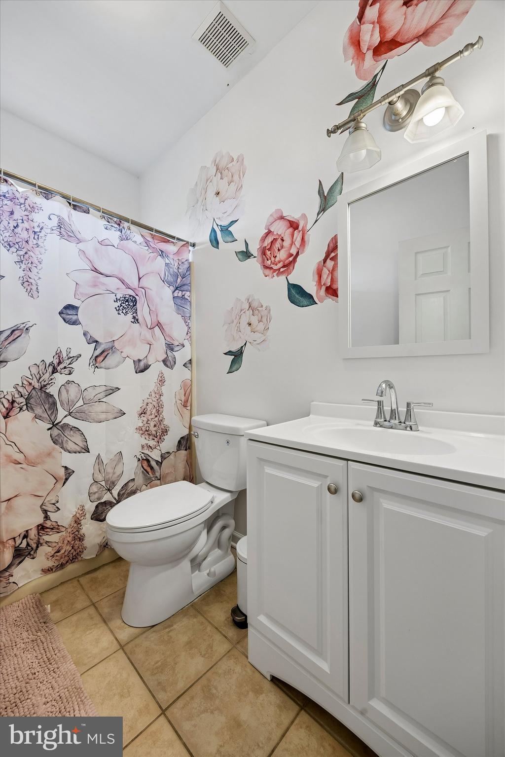 706 Kings Highway Mannington, NJ 08079 - Photo 26 of 35 a bathroom with a sink toilet and a mirror