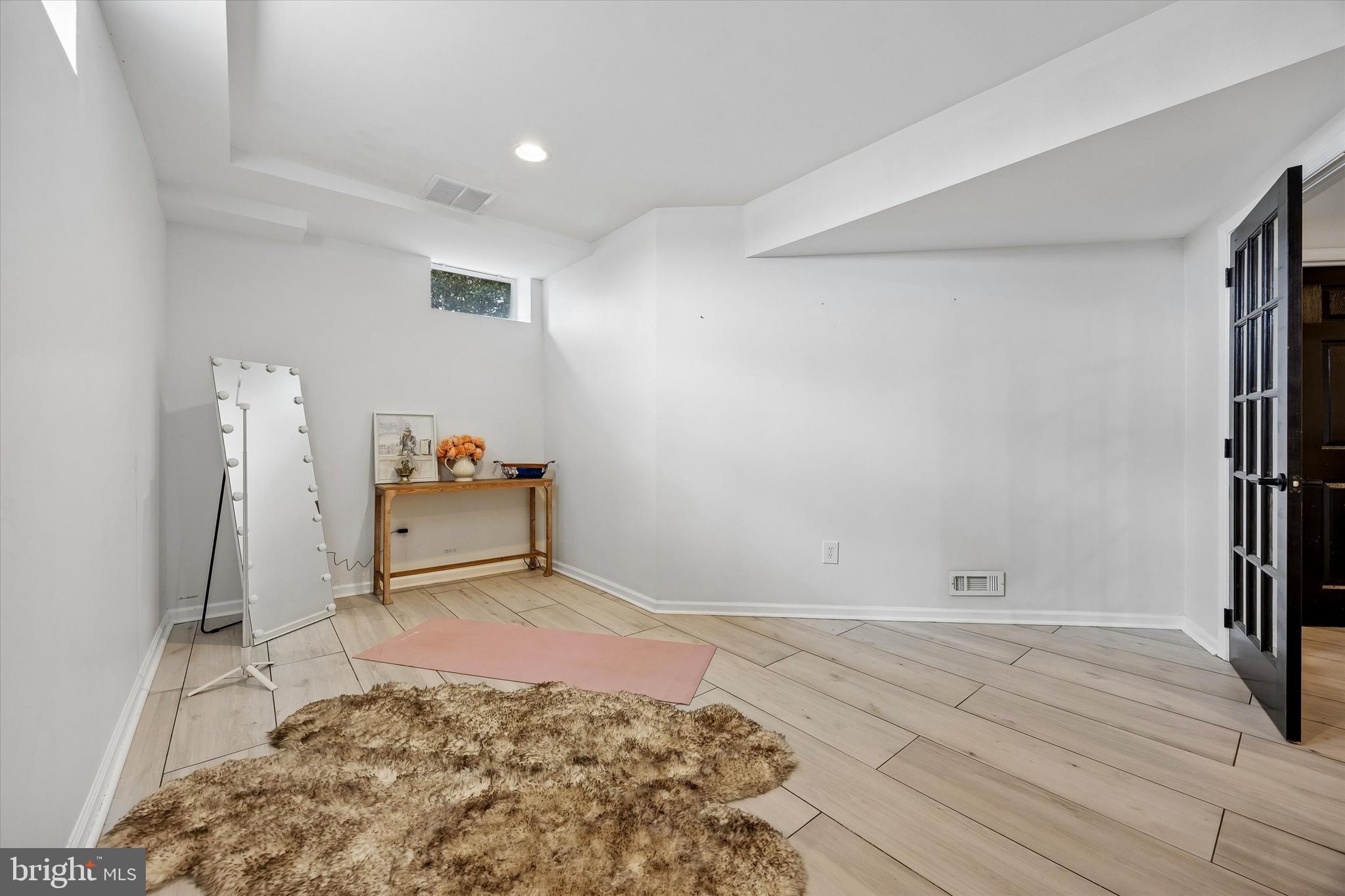 706 Kings Highway Mannington, NJ 08079 - Photo 32 of 35 a view of a bedroom with a bed and wooden floor