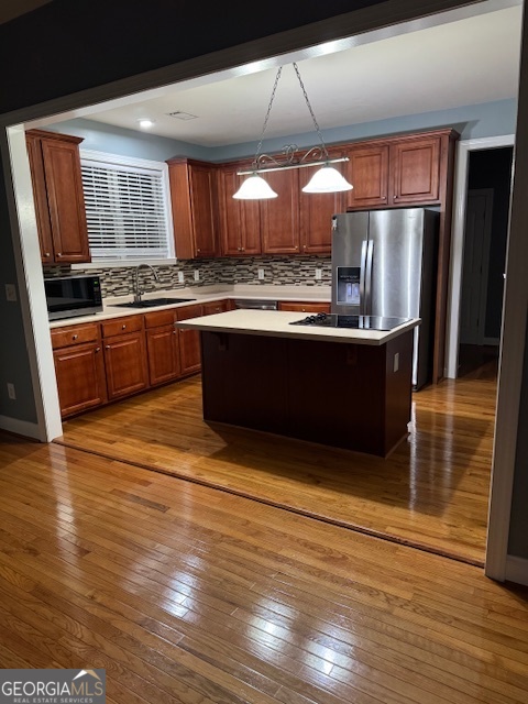 430 Bethany Road Covington, GA 30016 - Photo 8 of 39 a kitchen with stainless steel appliances granite countertop a refrigerator a sink and a stove