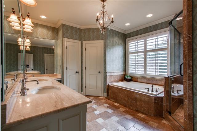 123 Page Road Nashville, TN 37205 - Photo 13 of 20 The master bath is attached to the master bedroom and has a large walk-in shower, Whirlpool tub, double vanities, a water closet, and a walk-in closet.