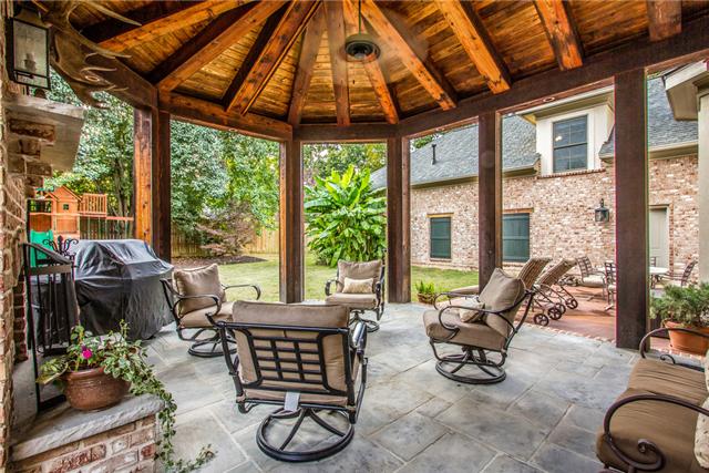 123 Page Road Nashville, TN 37205 - Photo 19 of 20 This gorgeous covered patio with a wood burning fireplace and fan is perfect for entertaining all year around!