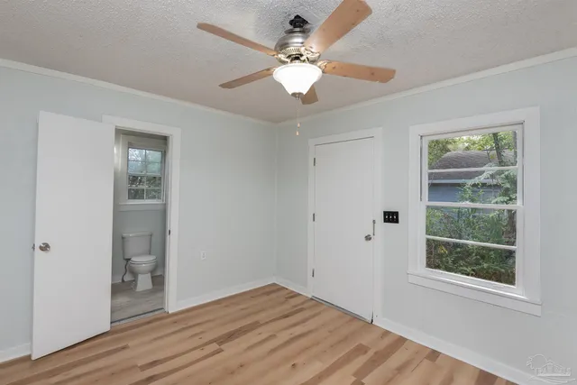 a bathroom with a toilet and shower