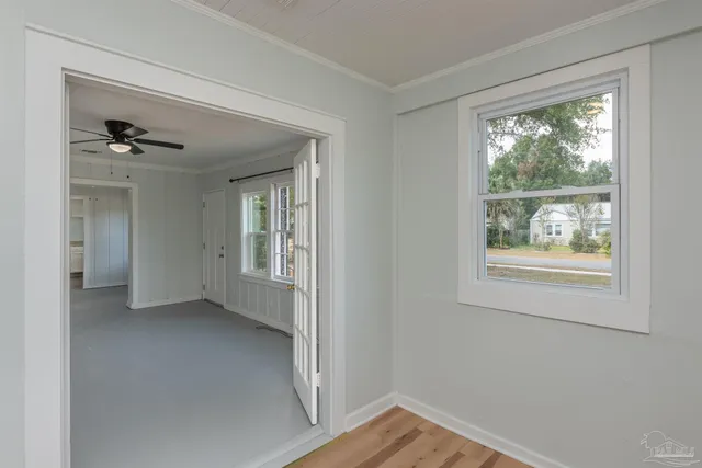 a view of an empty room with a window