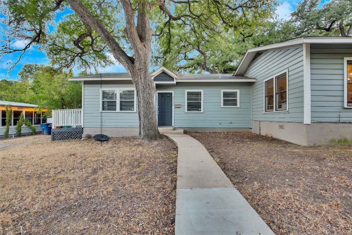 a house with trees in the background