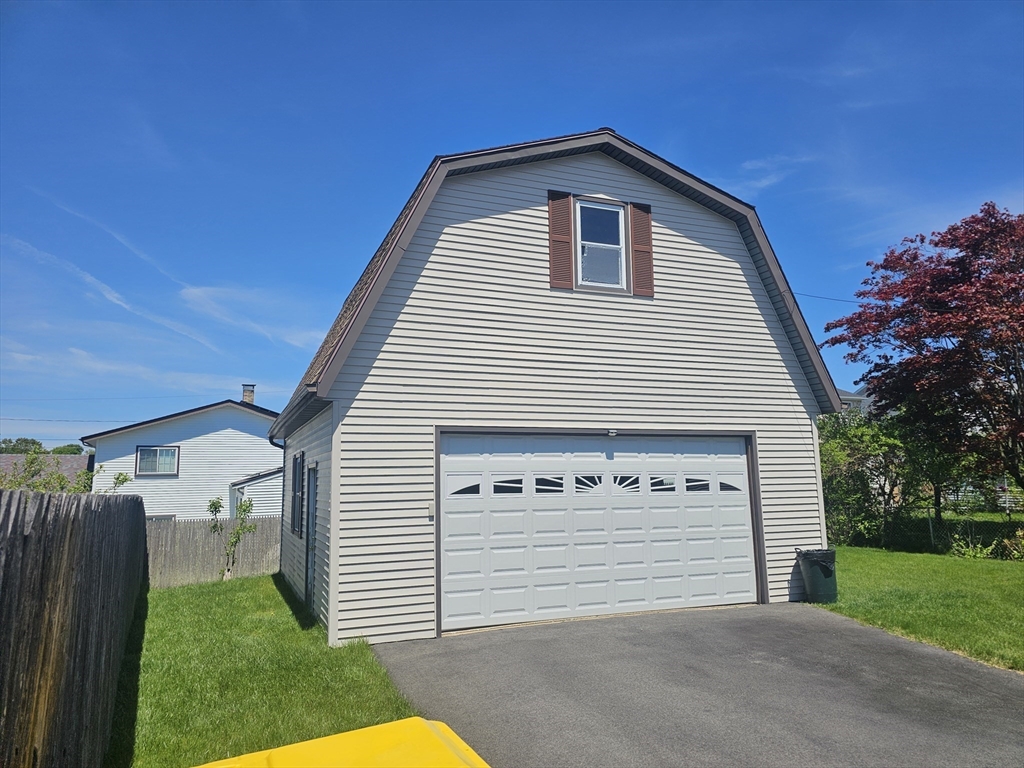 478 Tucker Street Fall River, MA 02721 - Photo 3 of 38 a front view of a house with a yard