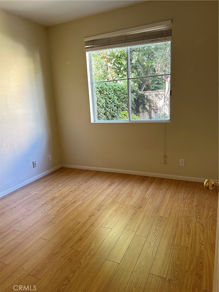 35 Del Cambrea Irvine, CA 92606 - Photo 5 of 21 an empty room with wooden floor and windows