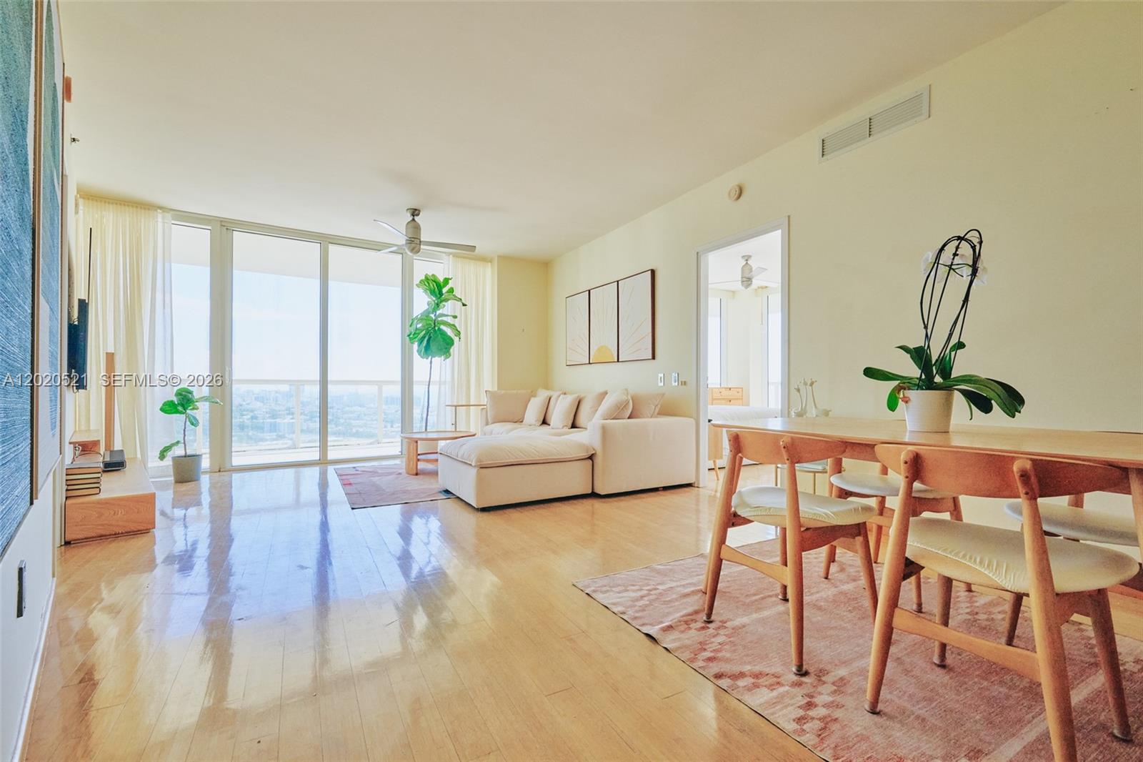 450 Alton Road, Unit 2810 Miami Beach, FL 33139 - Photo 5 of 29 a living room with furniture and a large window