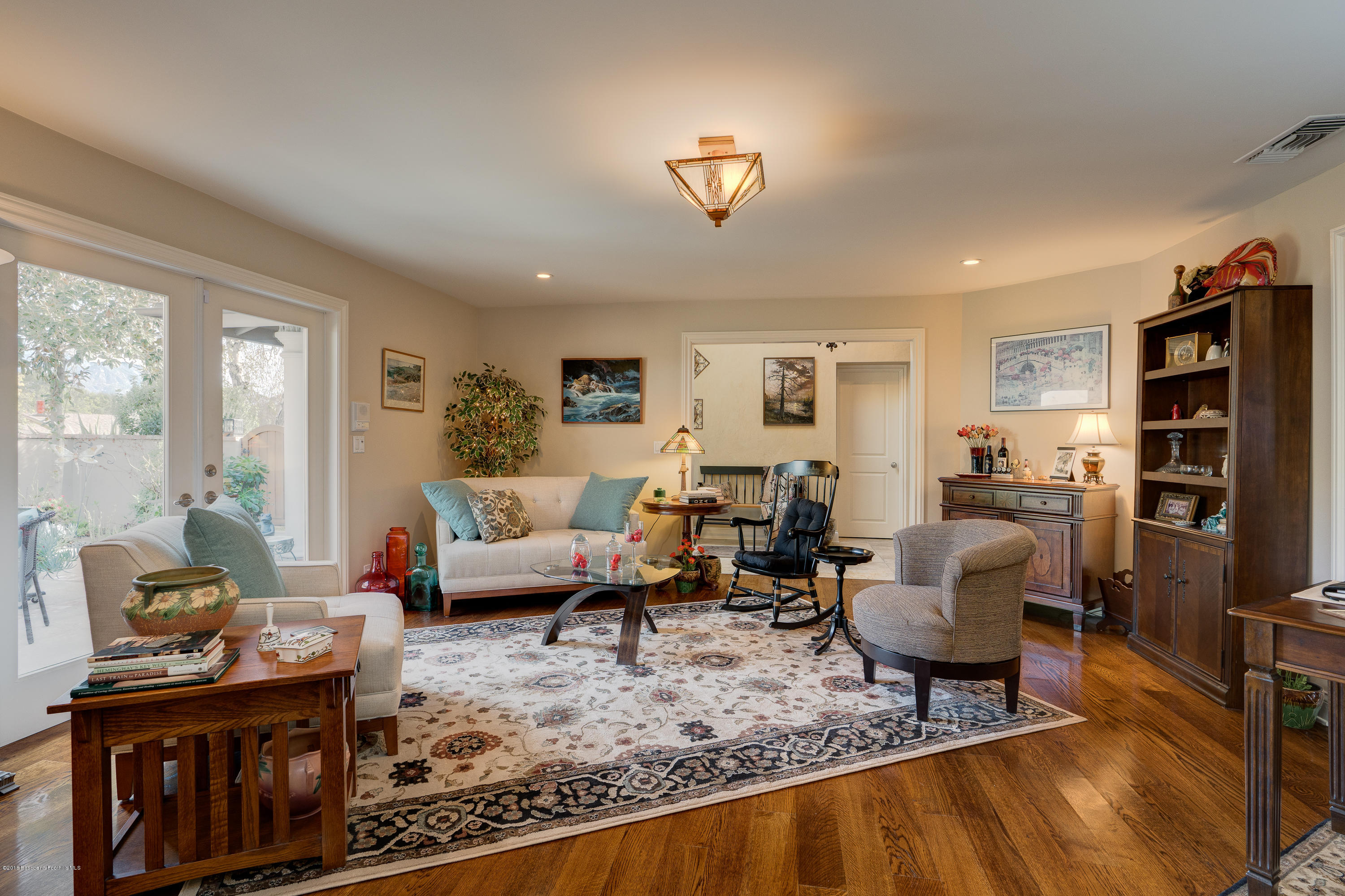 1550 Pegfair Estates Drive Pasadena, CA 91103 - Photo 6 of 16 a living room with furniture and a flat screen tv