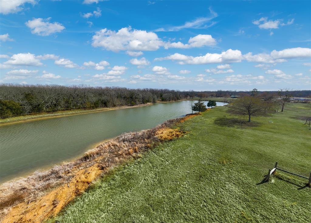 1900 County Road 33900 Powderly, TX 75473 - Photo 16 of 40 a view of a lake with a yard