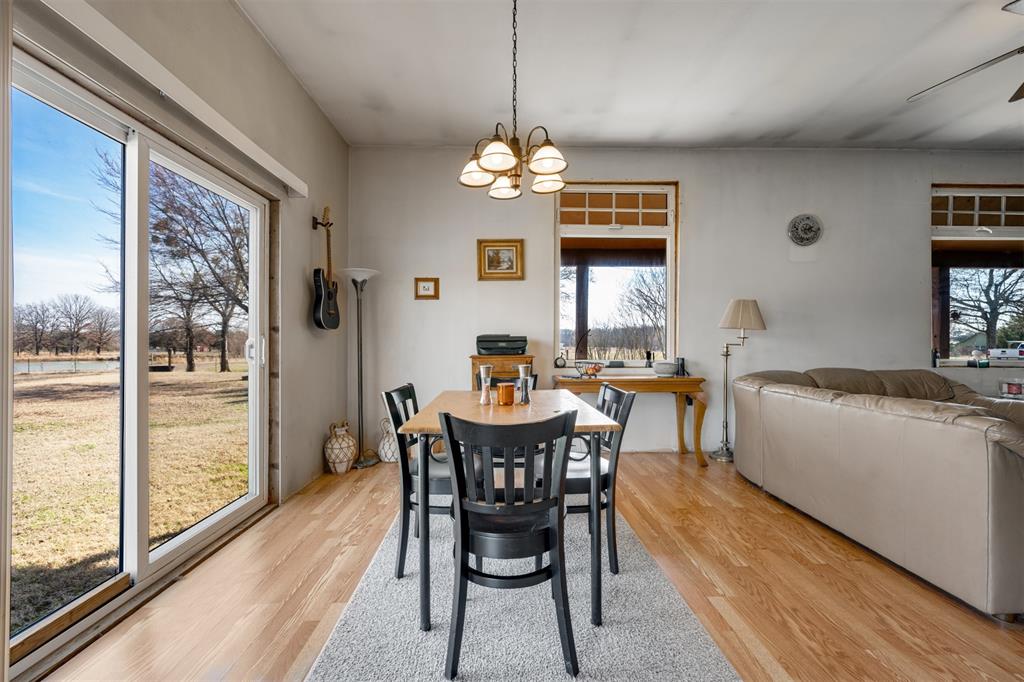 1900 County Road 33900 Powderly, TX 75473 - Photo 26 of 40 a dining room with furniture a chandelier and window