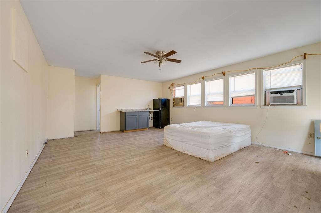 1900 County Road 33900 Powderly, TX 75473 - Photo 28 of 40 a spacious bedroom with a bed and window
