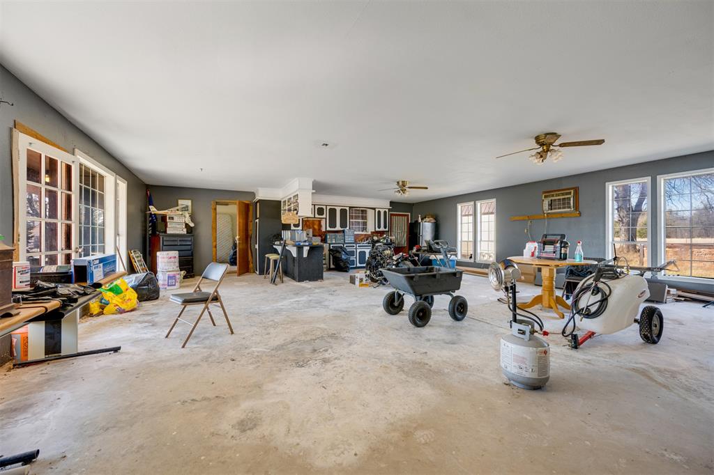 1900 County Road 33900 Powderly, TX 75473 - Photo 32 of 40 a view of a livingroom with furniture and a garage