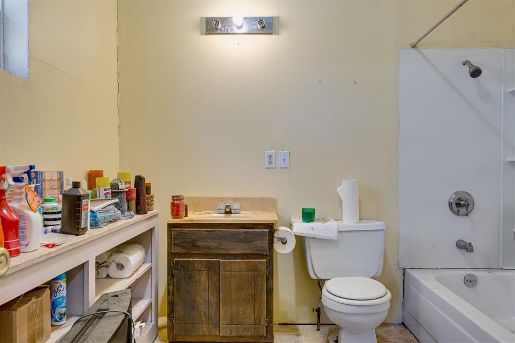 1900 County Road 33900 Powderly, TX 75473 - Photo 33 of 40 a bathroom with a sink a toilet and a shower