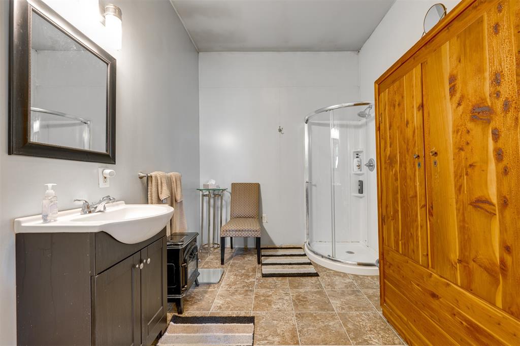1900 County Road 33900 Powderly, TX 75473 - Photo 34 of 40 a bathroom with a sink a toilet and shower