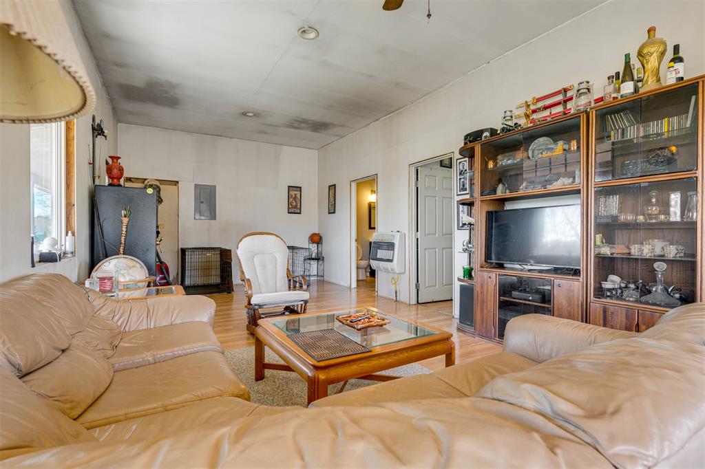 1900 County Road 33900 Powderly, TX 75473 - Photo 35 of 40 a living room with furniture fireplace and a flat screen tv