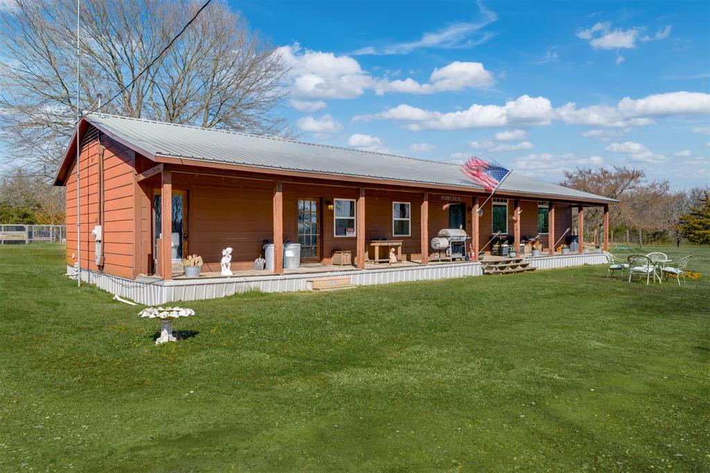1900 County Road 33900 Powderly, TX 75473 - Photo 7 of 40 a front view of a house with garden