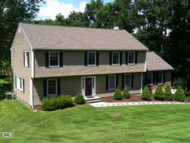 4 Signal Hill Road Brookfield, CT 06804 - Photo 1 of 1 a front view of a house with a yard