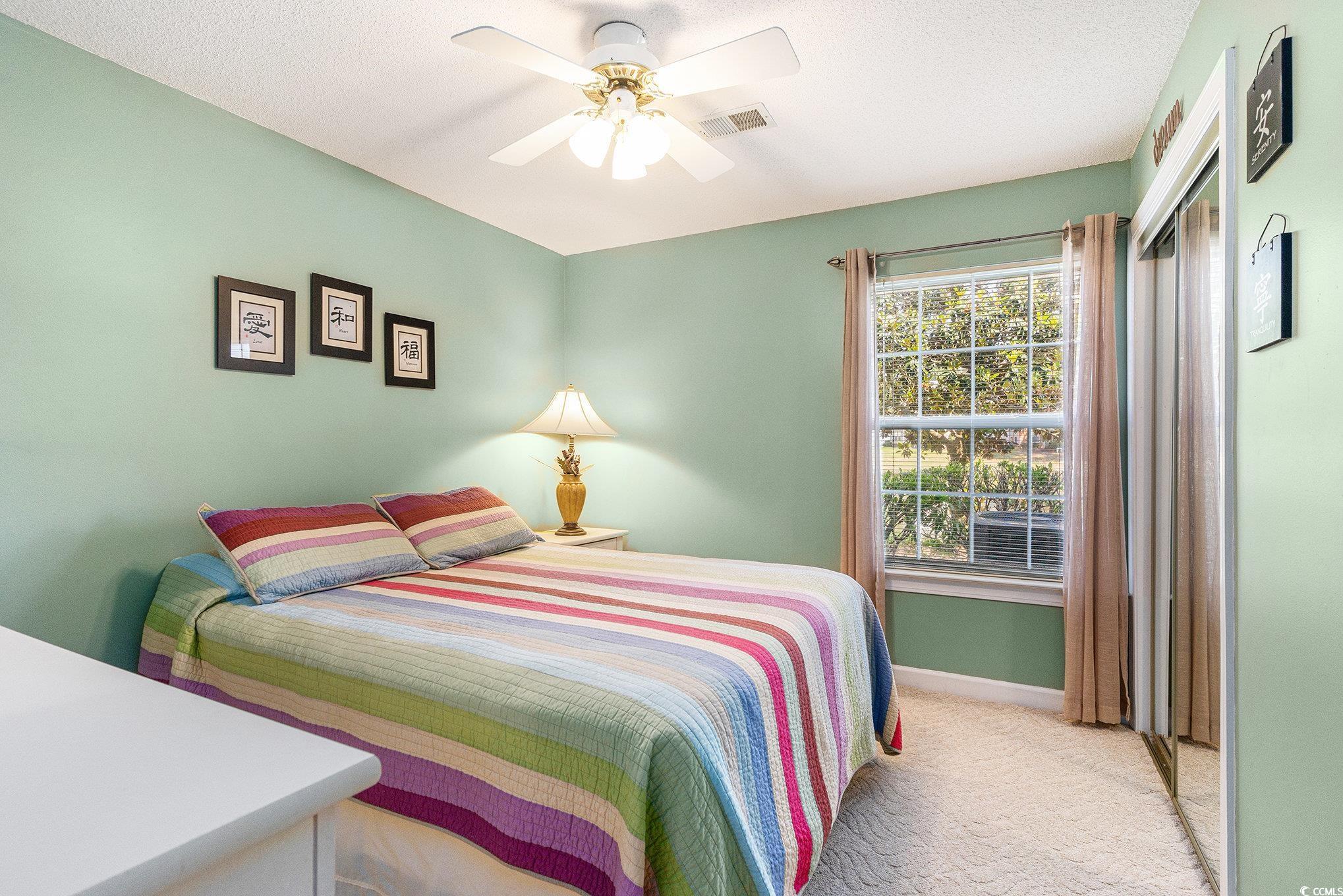 4280 Santolina Way, Unit C Murrells Inlet, SC 29576 - Photo 13 of 40 Bedroom with light colored carpet, baseboards, and ceiling fan