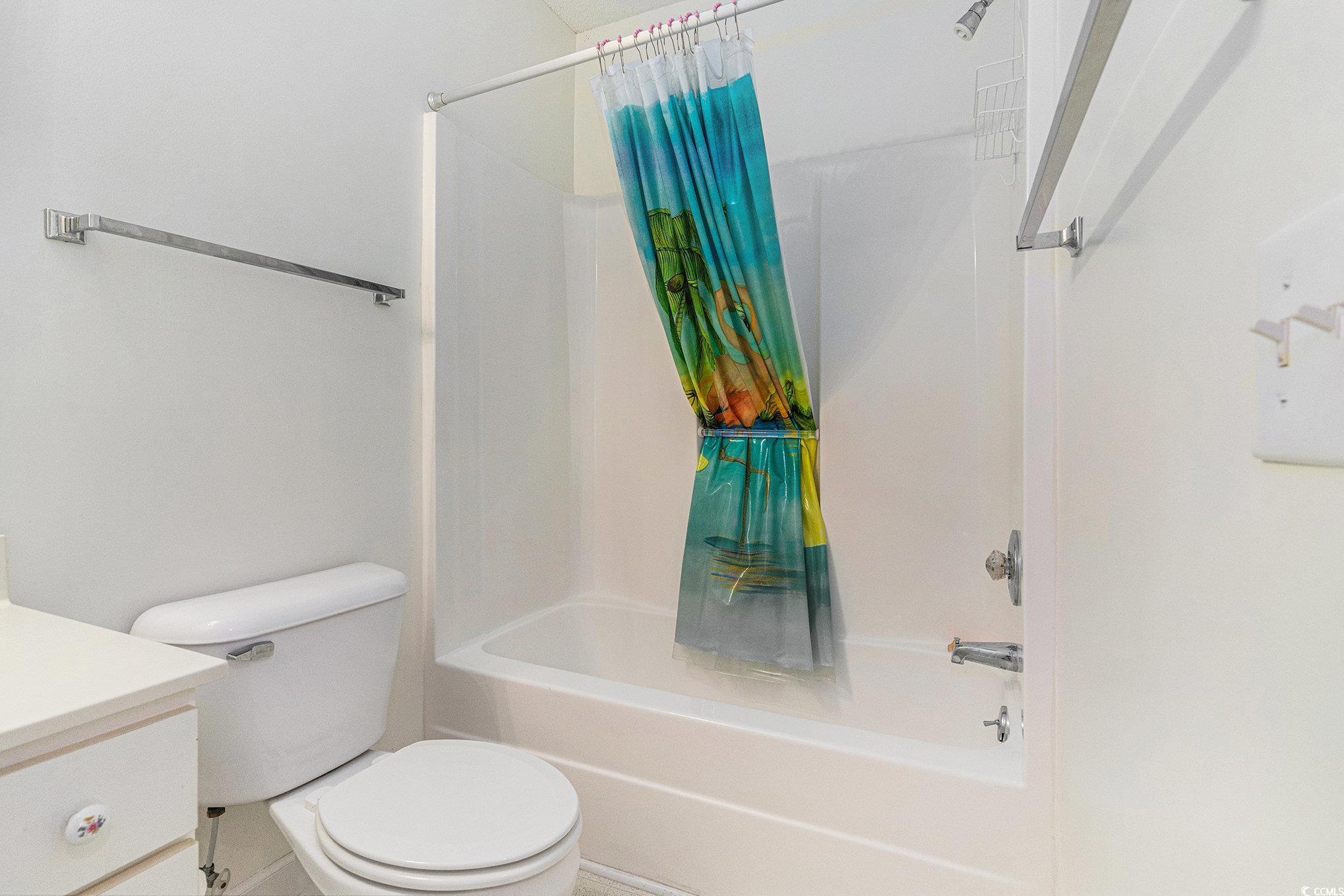4280 Santolina Way, Unit C Murrells Inlet, SC 29576 - Photo 17 of 40 Bathroom with shower / bath combo with shower curtain, toilet, and vanity