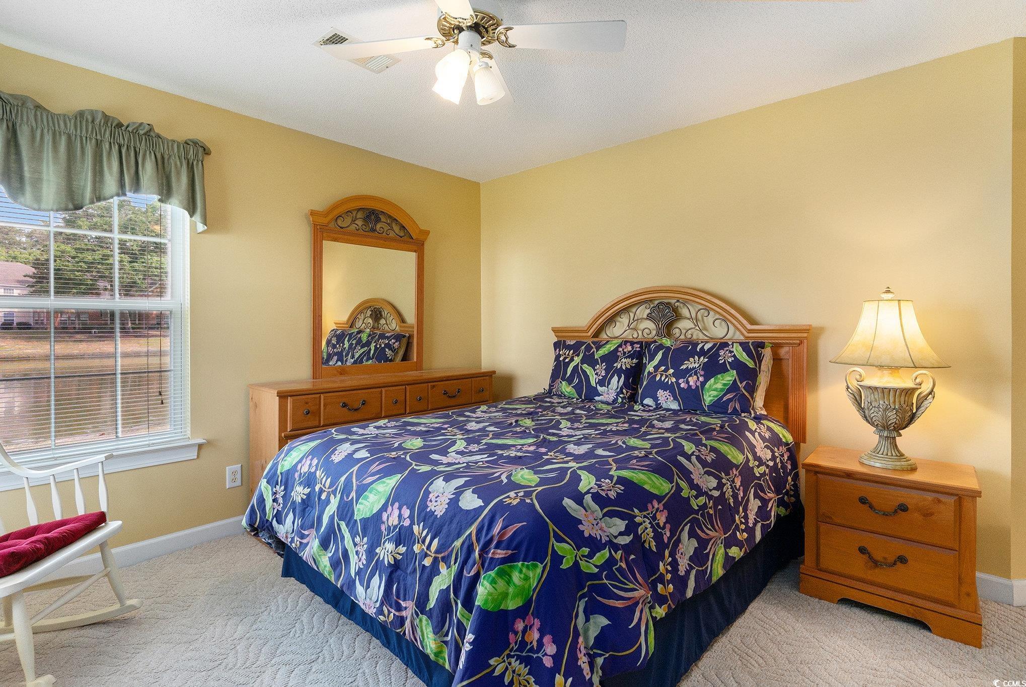 4280 Santolina Way, Unit C Murrells Inlet, SC 29576 - Photo 21 of 40 Bedroom featuring carpet floors, baseboards, and a ceiling fan