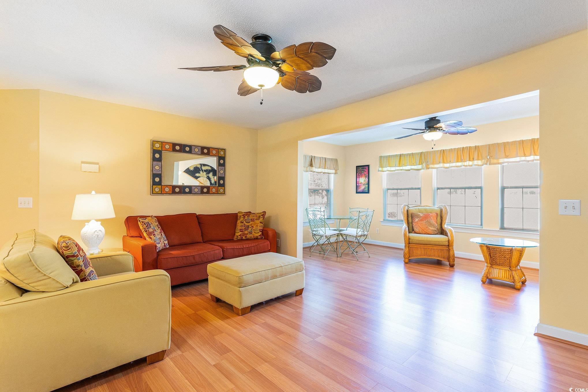 4280 Santolina Way, Unit C Murrells Inlet, SC 29576 - Photo 3 of 40 Living room featuring ceiling fan, light wood-type flooring, and baseboards
