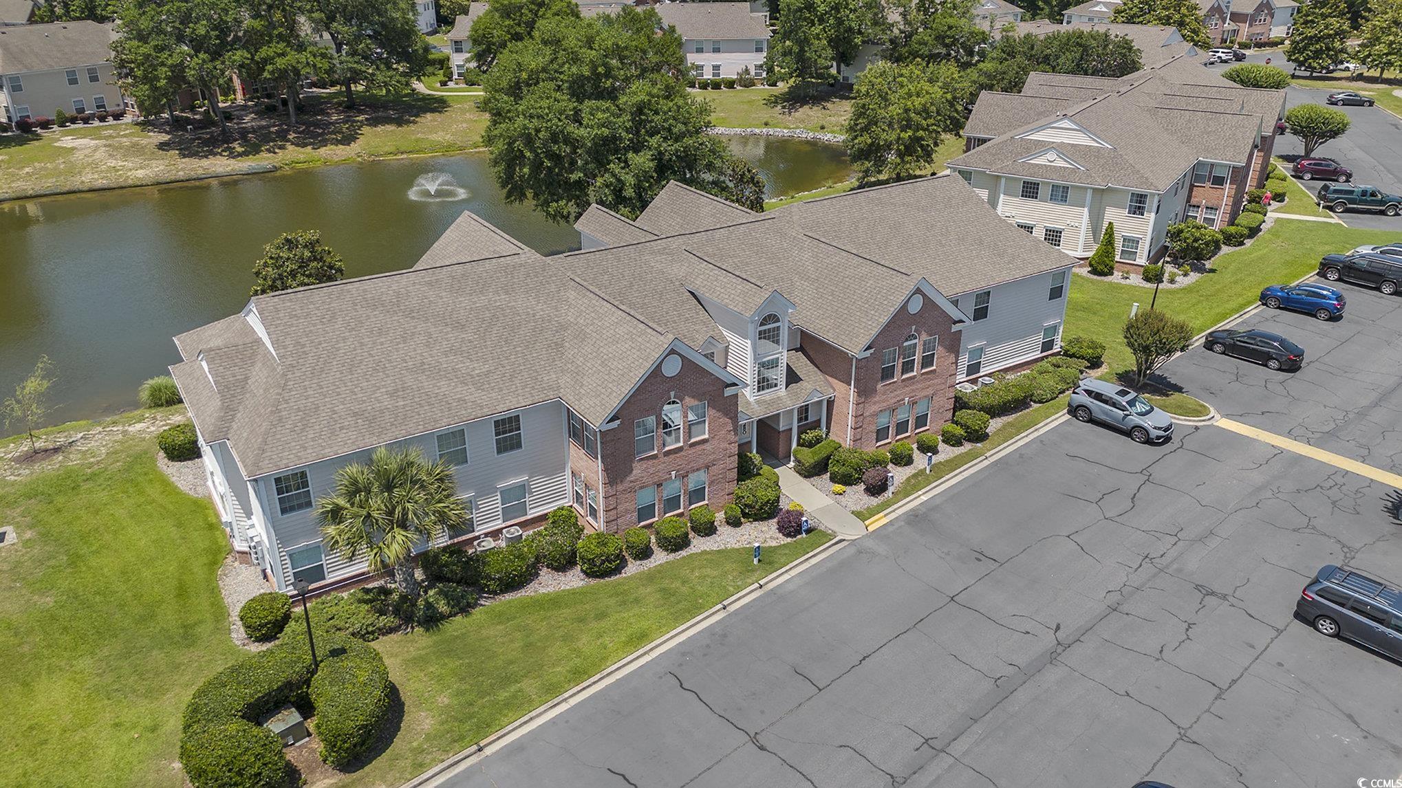 4280 Santolina Way, Unit C Murrells Inlet, SC 29576 - Photo 39 of 40 Aerial perspective of suburban area with a large body of water