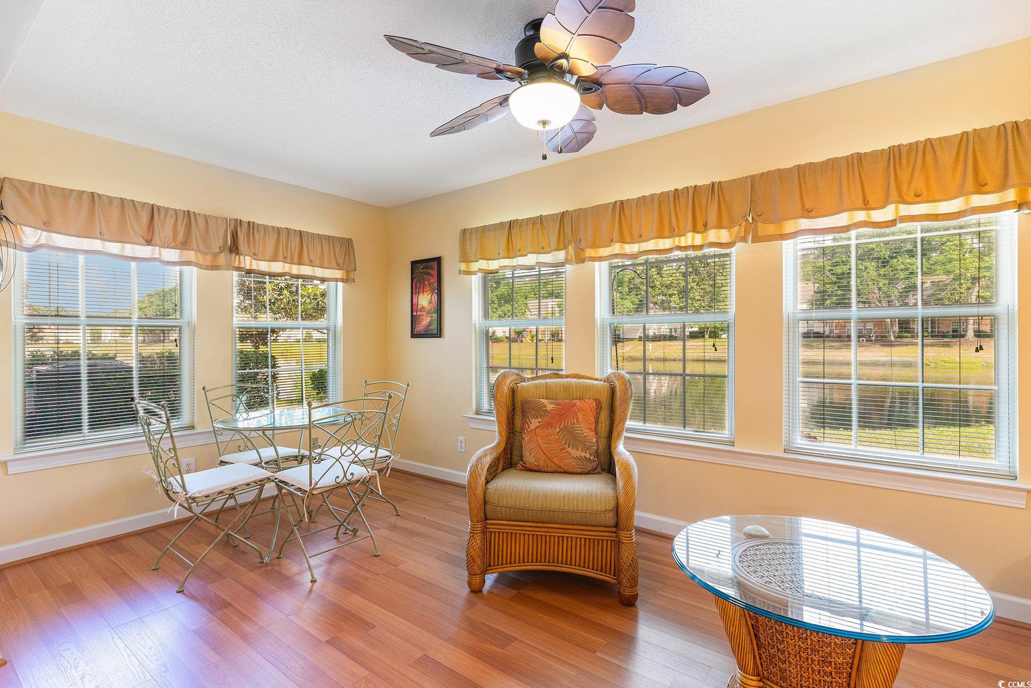 4280 Santolina Way, Unit C Murrells Inlet, SC 29576 - Photo 4 of 40 Living area featuring light wood-style floors, a ceiling fan, and baseboards