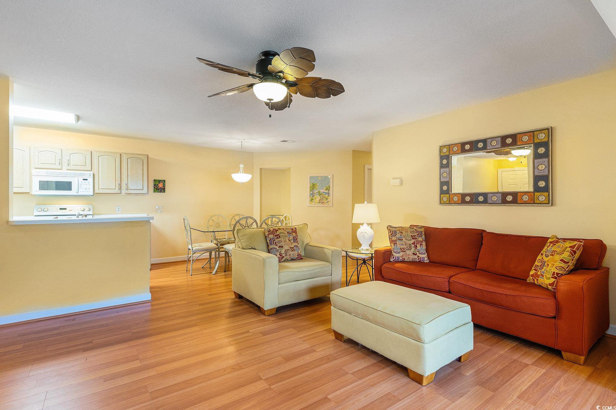 4280 Santolina Way, Unit C Murrells Inlet, SC 29576 - Photo 6 of 40 Living area featuring light wood-type flooring, a ceiling fan, and baseboards