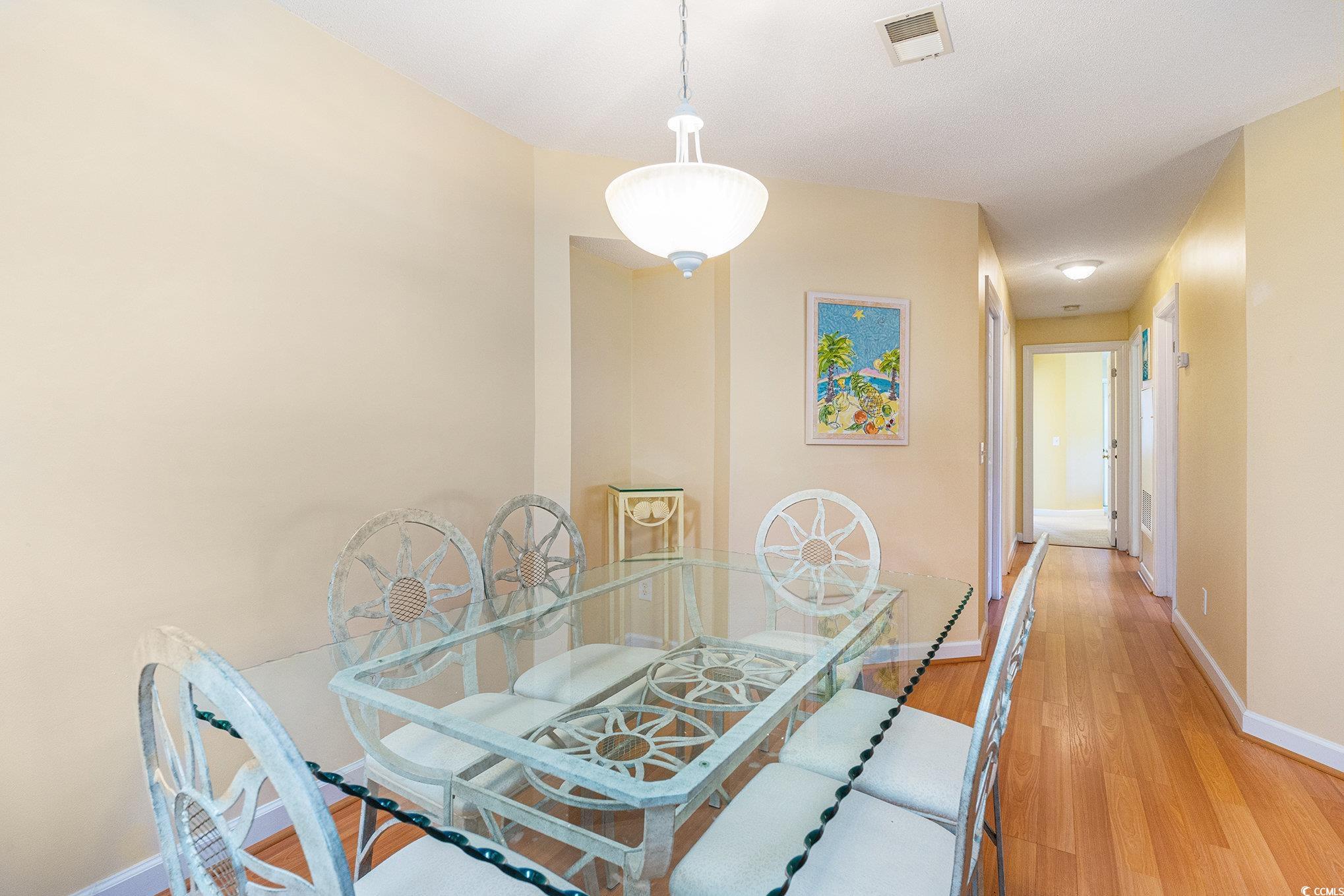 4280 Santolina Way, Unit C Murrells Inlet, SC 29576 - Photo 7 of 40 Dining space featuring baseboards and light wood-style floors