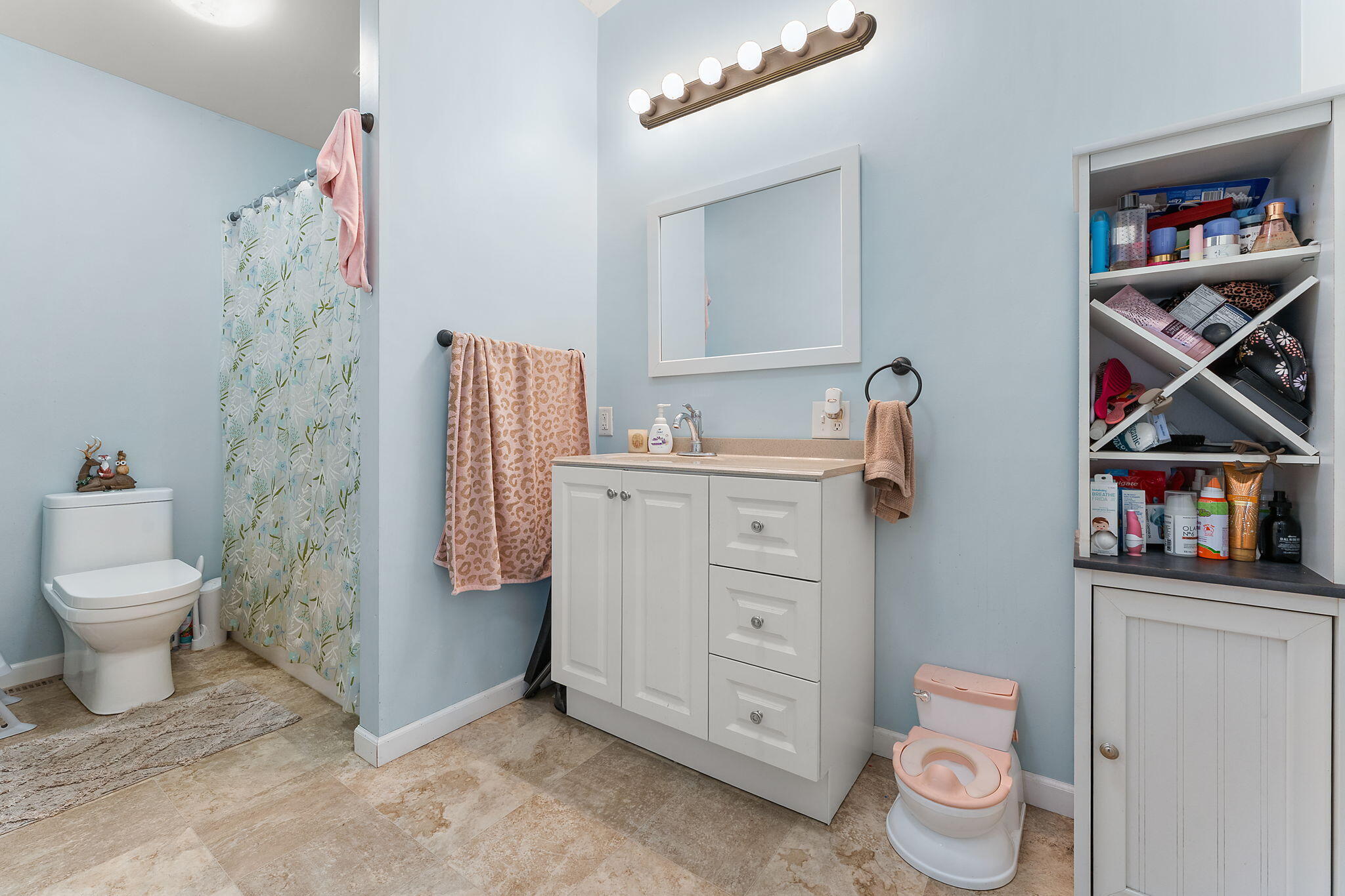 208 Stevenson Street Morocco, IN 47963 - Photo 21 of 31 a room with a baby crib and a couch